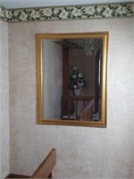 Large wall mirror in gold frame