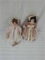 Two porcelain dolls, one with stand