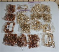 16 bags of acorn ornaments in gold and copper