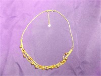 10K YELLOW GOLD TRI-STRAND NECKLACE