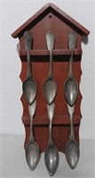 6 Pewter spoons on hanging rack