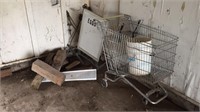 Shopping cart, anchors, sign, wood blocks