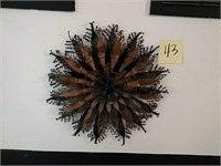 Gold and black metal wall decor