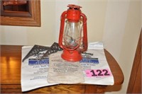 Red lantern, iron brackets, & advert. linen sacks