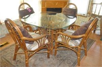 Rattan & glass dinning table w/ (4) Captains Chrs