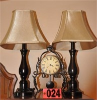 Pair of black metal table lamps, and metal clock