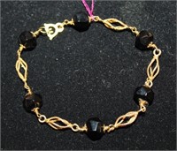 14kt yellow gold Bracelet w/ 6 black onyx beads
