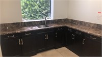 Laundry room cabinets with marble countertops