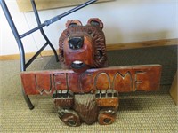 Carved wood bear w/ welcome sign