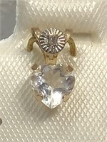 $160 10 KT Gold White Topaz and Diamond Pendant