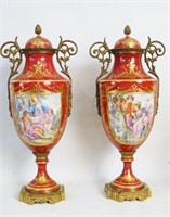 Pair of French porcelain rouge scenic urns