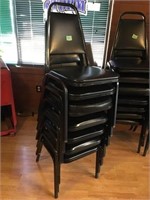 7 black stack chairs