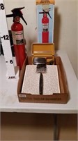 Fire extinguisher, bathroom scale and Norco Razor