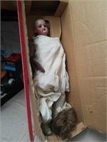 Vintage doll has been repaired