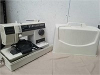 Singer sewing machine in carrying case