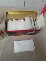 Group of basketball cards in tin container