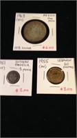 Three collectible coins from different countries