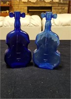 Pair of blue violin bottles approx 8 inches tall
