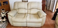 Inviting off white leather love seat both sides