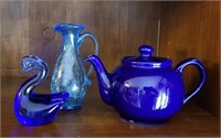 Blue glass swan paper weight and teapots