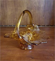Unusual amber colored basket with circle pattern