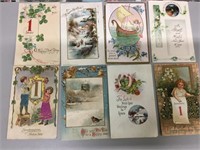 Lot of eight New Year’s Day postcards.