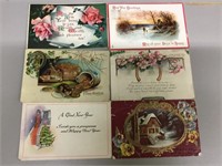 Lot of six New Year’s postcards.