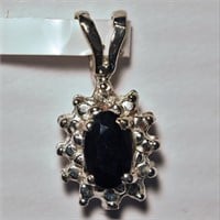 $700. 14KT Diamond Sapphire Pendant