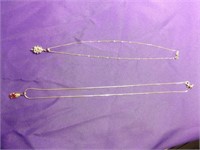 TWO STERLING SILVER NECKLACES WITH PENDANTS