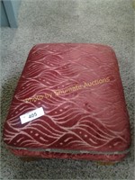 Red upholstered foot stool