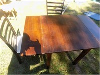 square dark wood kitchen table with 3 chairs