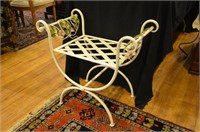 Painted iron garden bench with floral decoration