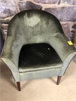 Green upholstered barrel back chair