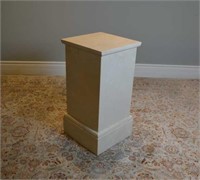 Square column form stone pedestal