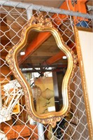 Ornate gilt framed wall mirror,
