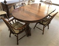 Medium oak dining room table, six chairs