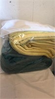 Yellow and green blankets in bag