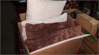 Box of four pillows and a mat