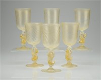 Six Murano glass goblets with figural stems