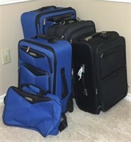 Four Rolling Nylon Suitcases