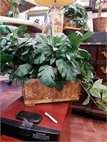 Silk plant in a wooden rectangle basket