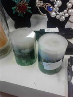 pair of green navy blue and tan candles