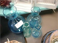 Set of 4 blue glass bottles