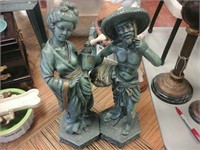 Set of green Japanese man and woman sculptures
