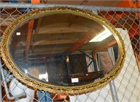 Gilt framed vintage oval wall mirror,