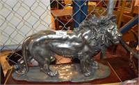 Silver gilt resin model of a standing lion,