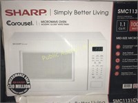 SHARP 1,1 CU FT MICROWAVE OVEN $139 RETAIL