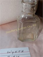 Embossed Wyeth glass bottle, 3 1/2"t