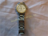 Timex Watch with date, gold trim on face and gold