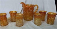 Marigold carnival glass pitcher & glasses (6)